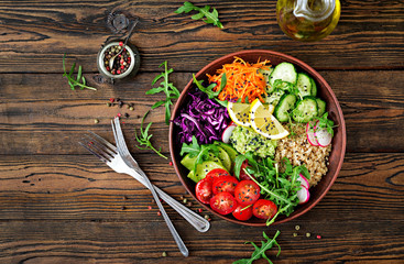 Vegetarian Buddha bowl with quinoa and fresh vegetables. Healthy food concept. Vegan salad. Top view. Flat lay