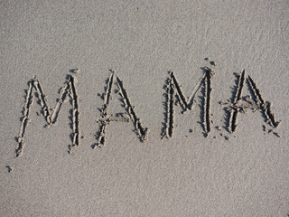 word mother is written on the sand