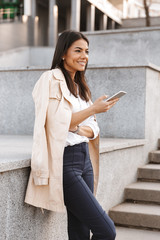 Sticker - Attractive young woman using mobile phone