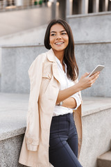 Poster - Pretty young woman using mobile phone