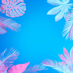 Wall Mural - Tropical and palm leaves in vibrant bold gradient holographic neon  colors. Concept art. Minimal surrealism summer background.