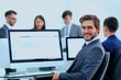 © ASDF - Businessman analyzing economic graphs at office