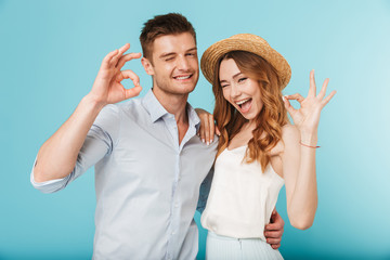 Happy caucasian people man and woman showing okay gesture.