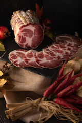 Assortment of various meat and sausages on wooden table