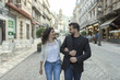 © FotoAndalucia - Couple walking and having fun walking in the street together