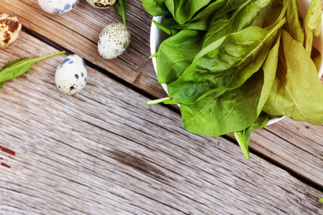 Leaves spinach, quail eggs, detox, Healthy food, wooden backgrou