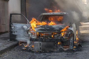 Fire engulfing a car 