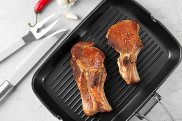 Sticker - Grill pan with delicious ribs on table