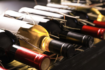 Sticker - Bottles with delicious wine on shelf, closeup. Professional sommelier