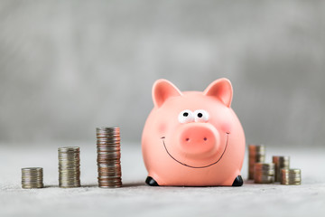 Piggy bank on grey background