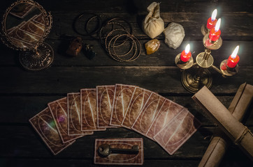 Wall Mural - Tarot cards on fortune teller desk table background. Futune reading concept. Magic mirror and key to the fate.