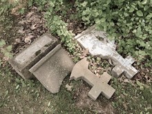 Two Broken Crosses In An Old Graveyard
