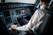 Pilot's Hand Accelerating On The Throttle In  A Commercial Airliner Airplane Flight Cockpit During Takeoff