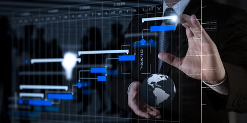 Poster - Businessman hand working with a digital tablet on meeting room background