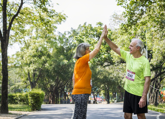 Wall Mural - Couple running together in a race