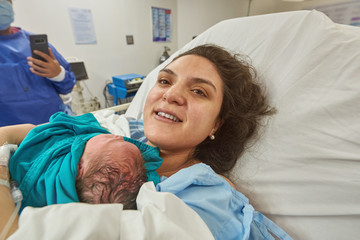 Happy mother with newborn