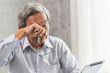 Asian elderly eye irritation problem fatigue and tired from hard work or computer vision syndrome