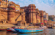 Historic Varanasi city with with ancient architecture along the Ganges river ghat as viewed from a boat. Varanasi is located in the state of Uttar Pradesh India.