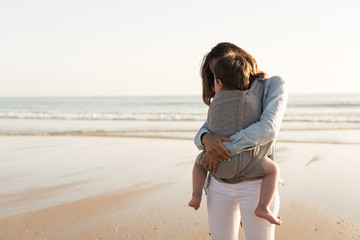 Wall Mural - Mother carrying baby