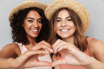 Canvas Print - Close up portrait of two smiling young women