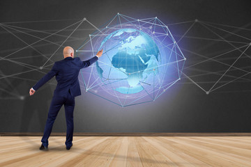 Poster - Businessman in front of a wall with a Connected network over a earth globe concept on a futuristic interface - 3d rendering