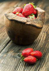 Sticker - Ripe juicy strawberries on a wooden background