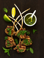 Wall Mural - Lamb chops on bone, with mint-garlic sauce and couscous.