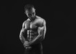 © Prostock-studio - Strong athletic man showes naked muscular body