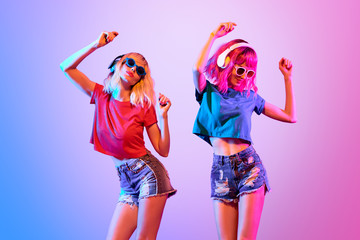 Two DJ Girl Hipster with Fashion Hairstyle Dance.