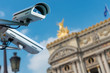 security CCTV camera or surveillance system with ancient monument on blurry background