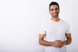 © Ranta Images - Young handsome Indian man against white background
