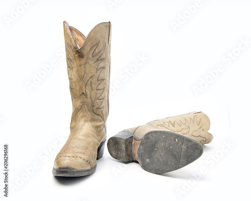 Fotografía Brown cowboy boots isolated on a white background.