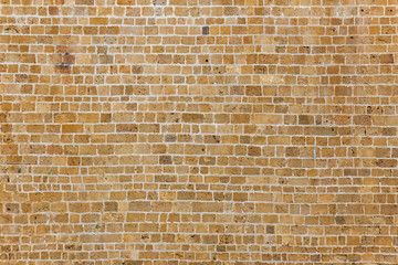 ancient natural stone wall as a texture or background.