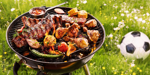 Fotomural Summer or spring barbecue outdoors in a meadow