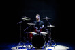 © nagaets - Silhouette drummer on stage. Dark background, smoke spotlights