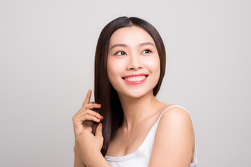 Beautiful Woman touch her health long straight hair care with smile face, asian beauty model