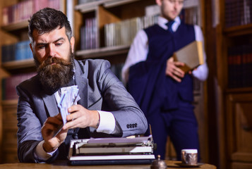 Leinwandbilder - Writing and fees concept. Man in oldfashioned suit holds money.