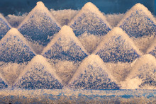 Ice Cubes In A Blue Ice Container Covered With Frozen Grains.