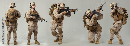 Fotografía Soldier in camouflage holding rifle