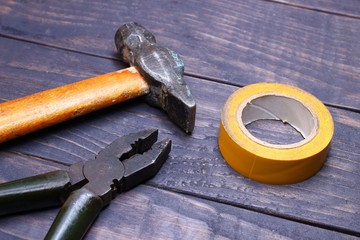 Wall Mural - Hammer, screwdriver, tools on a dark background