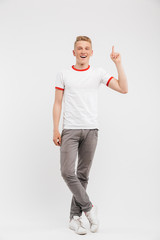 Poster - Full length portrait of a smiling teenage boy