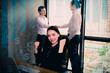 © S photographer - Youngs is working in office building background