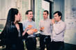 © S photographer - Youngs business people are celebrating success.