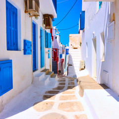 Old street with white houses in Mykonos