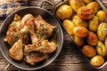 Roasted Chicken Legs With Potatoes Cumin Pepper And Herbs Top Of View