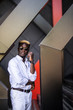 © F8  \ Suport Ukraine - Handsome young afro american man in white clothes and sundglasses on urban background