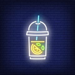 Wall Mural - Lemonade neon sign. Glass of iced tea with lemon on dark brick wall background. Night bright advertisement. Vector illustration in neon style for cafe or beach bar