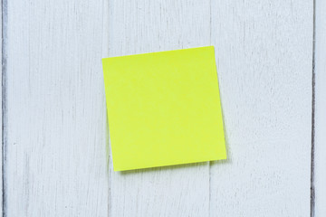 Many colorful sticky note, post note on white wooden vintage background