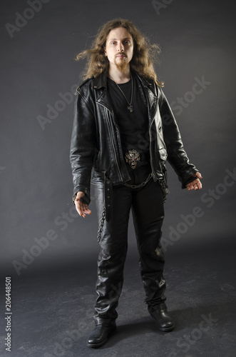 Portrait Of A Metalhead Young Man With Long Hair And Beard