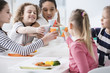 © Photographee.eu - Multicultural group of children toasting during birthday party at home